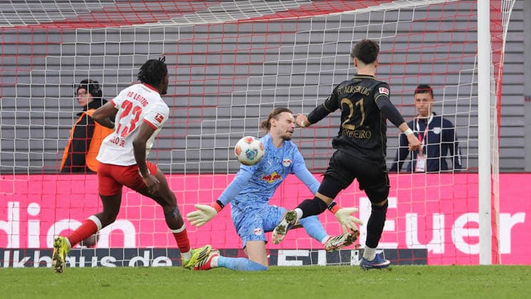 Castello Lukeba, goalkeeper Maarten Vandevoordt, Rodrigo Ribeiro misses the goal duel Match scene Action Sport Football Soccer DFL Bundesliga Men 25 Matchday Season 2025 2026 07 03 2026 RasenBallsport RB Leipzig RBL vs FC Augsburg FCA at RedBull Arena DFL regulations prohibit any use of photographs as image sequences and or quasi video