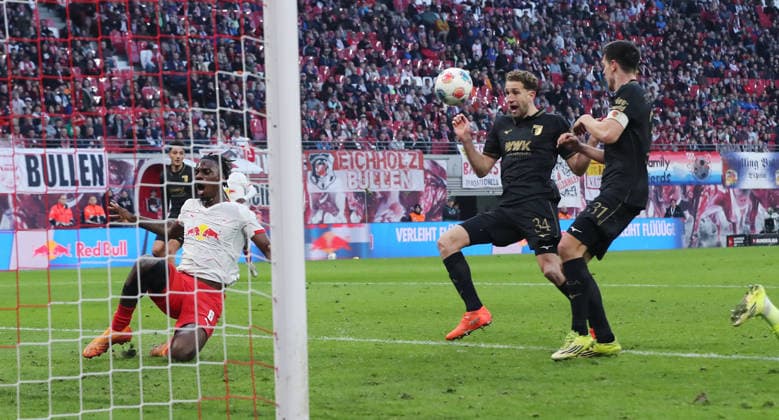 Arthur Chaves 34 scores own goal for 2 1 duel Match scene Action Sport Football Soccer DFL Bundesliga Men 25 Matchday Season 2025 2026 07 03 2026 RasenBallsport RB Leipzig RBL vs FC Augsburg FCA at RedBull Arena DFL regulations prohibit any use of photographs as image sequences and or quasi video