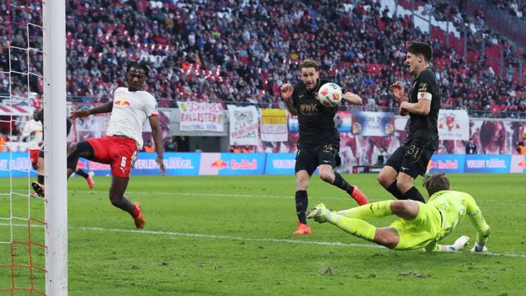 Arthur Chaves 34 scores own goal for 2 1 duel Match scene Action Sport Football Soccer DFL Bundesliga Men 25 Matchday Season 2025 2026 07 03 2026 RasenBallsport RB Leipzig RBL vs FC Augsburg FCA at RedBull Arena DFL regulations prohibit any use of photographs as image sequences and or quasi video