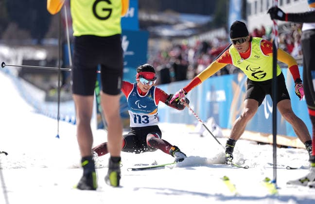 (260308) -- TESERO, March 8, 2026 -- Wang Yue (L) and her guide Chen Guoming of China cross the finish line during the women s sprint vision impaired final of para biathon at the Milan-Cortina 2026 Paralympic Winter games, Winterspiele,Spiele, Summer games in Tesero, Italy, March 7, 2026. ) (SP)ITALY-TESERO-PARALYMPIC WINTER GAMES-PARA BIATHLON-WOMEN S SPRINT VISION IMPAIRED HouxZhaokang 