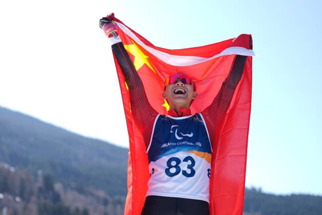 (260308) -- BEIJING, March 8, 2026 -- Cai Jiayun of China celebrates after winning the men s sprint standing final of para biathon at the Milan-Cortina 2026 Paralympic Winter games, Winterspiele,Spiele, Summer games in Tesero, Italy, March 7, 2026. ) XINHUA PHOTOS OF THE DAY HouxZhaokang 