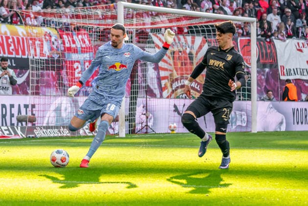 Leipzig, Germany 07 March 2026 1 Bundesliga 2025 2026 RB Leipzig vs FC Augsburg In the picture from left in a duel goalkeeper Maarten Vandevoordt RB and Rodrigo Ribeiro FCA DFL regulations prohibit any use of photographs as image sequences and or quasi video Copyright: xFotostandx xNachtigallx