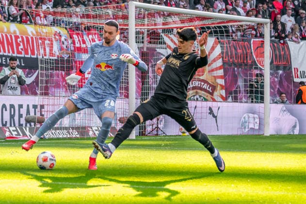 Leipzig, Germany 07 March 2026 1 Bundesliga 2025 2026 RB Leipzig vs FC Augsburg In the picture from left in a duel goalkeeper Maarten Vandevoordt RB and Rodrigo Ribeiro FCA DFL regulations prohibit any use of photographs as image sequences and or quasi video Copyright: xFotostandx xNachtigallx