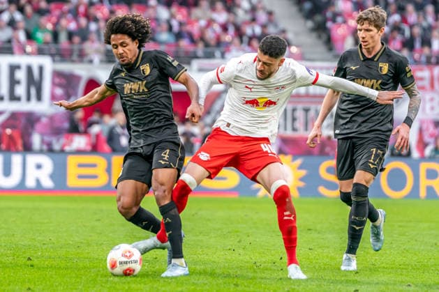 Leipzig, Germany 07 March 2026 1 Bundesliga 2025 2026 RB Leipzig vs FC Augsburg In the picture from left in a duel Han Noah Massengo FCA and Romulo RB DFL regulations prohibit any use of photographs as image sequences and or quasi video Copyright: xFotostandx xNachtigallx