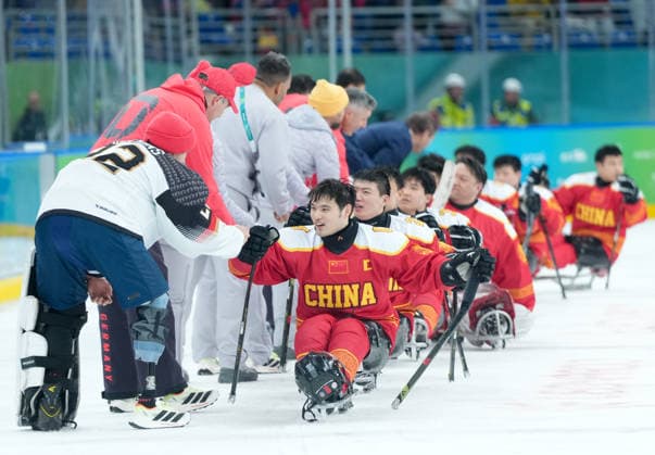 (260308) -- MILAN, March 8, 2026 -- Players of China greet Team Germany after the Para Ice hockey, Eishockey preliminary round Group A match between China and Germany at the Milan-Cortina 2026 Paralympic Winter games, Winterspiele,Spiele, Summer games in Milan, Italy, March 7, 2026. ) (SP)ITALY-MILAN-PARALYMPIC WINTER GAMES-PARA ICE HOCKEY-CHINA VS GERMANY LixJing 