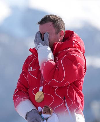 (260308) -- CORTINA D AMPEZZO, March 8, 2026 -- Gold medalist Robin Cuche of Switzerland reacts during the awarding ceremony for the para alpine skiing men s downhill standing match at the Milan-Cortina 2026 Paralympic Winter games, Winterspiele,Spiele, Summer games in Cortina D ampezzo, Italy, March 7, 2026. ) (SP)ITALY-CORTINA D AMPEZZO-PARALYMPIC WINTER GAMES-PARA ALPINE SKIING-MEN S DOWNHILL-STANDING WangxKaiyan 