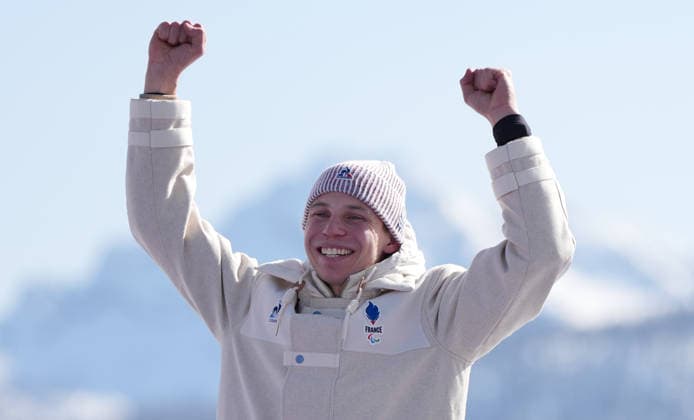 (260308) -- CORTINA D AMPEZZO, March 8, 2026 -- Silver medalist Arthur Bauchet of France reacts during the awarding ceremony for the para alpine skiing men s downhill standing match at the Milan-Cortina 2026 Paralympic Winter games, Winterspiele,Spiele, Summer games in Cortina D ampezzo, Italy, March 7, 2026. ) (SP)ITALY-CORTINA D AMPEZZO-PARALYMPIC WINTER GAMES-PARA ALPINE SKIING-MEN S DOWNHILL-STANDING WangxKaiyan 