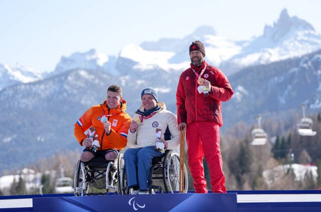 (260308) -- CORTINA D AMPEZZO, March 8, 2026 -- Gold medalist Jesper Pedersen (C) of Norway, silver medalist Niels de Langen (L) of the Netherlands, bronze medalist Kurt Oatway of Canada pose during the awarding ceremony for the para alpine skiing men s downhill sitting match at the Milan-Cortina 2026 Paralympic Winter games, Winterspiele,Spiele, Summer games in Cortina D ampezzo, Italy, March 7, 2026. ) (SP)ITALY-CORTINA D AMPEZZO-PARALYMPIC WINTER GAMES-PARA ALPINE SKIING-MEN S DOWNHILL-SITTING WangxKaiyan 