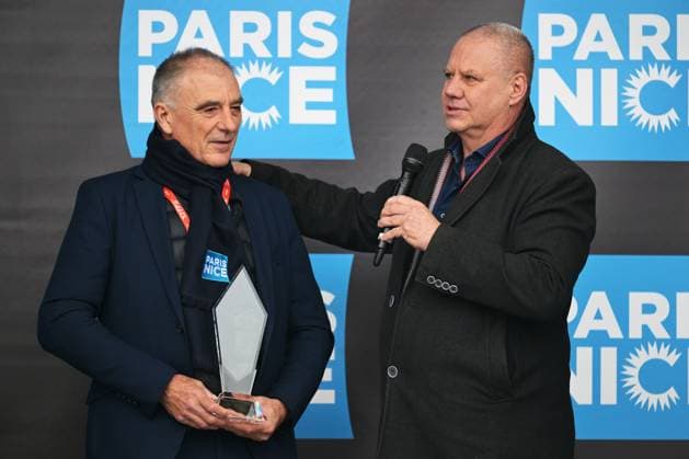 Jean-Francois Le Marchand receives a trophy from Flanders Classics Wim Van Herreweghe at the start of the first stage of 84th edition of the Paris-Nice cycling race, 170,9 km from Archeres to Carrieres-sous-Poissy, Sunday 08 March 2026. DAVIDxPINTENS  x166837072x