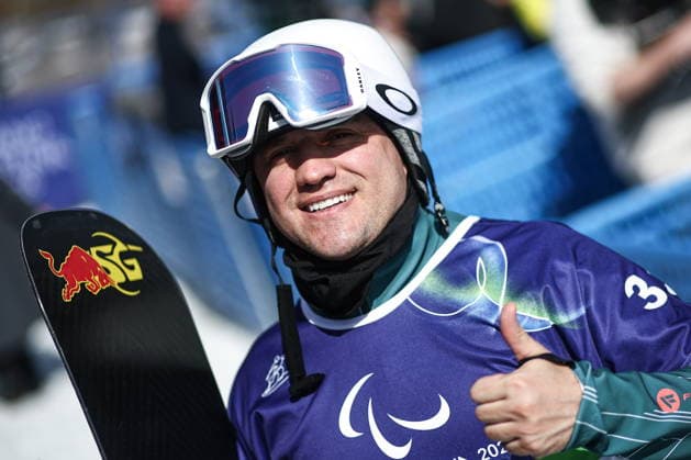 ITALY, VENETO - MARCH 8, 2026: Dmitry Fadeyev of Russia during the men s para snowboard snowboard cross SB-LL1 event at Cortina Para Snowboard Park during the 2026 Winter Paralympic Games. Mikhail Tereshchenko TASS  89753675