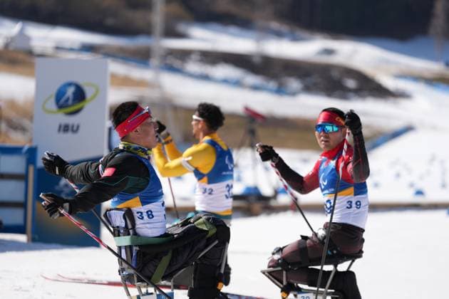 (260308) -- TESERO, March 8, 2026 -- Mao Zhongwu (L) and Wang Tao of China react after the men s individual sitting final of para biathon at the Milan-Cortina 2026 Paralympic Winter games, Winterspiele,Spiele, Summer games in Tesero, Italy, March 8, 2026. ) (SP)ITALY-TESERO-PARALYMPIC WINTER GAMES-PARA BIATHLON-MEN S INDIVIDUAL SITTING LianxZhen 