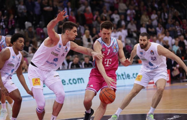 Grayson Murphy Bonn on the ball between Jure Planinic MBC, L and Nemanja Djurisic MBC , Telekom Baskets Bonn vs Syntainics MBC, easyCredit BBL, Matchday 23, Telekom Dome Bonn, 08 03 2026
