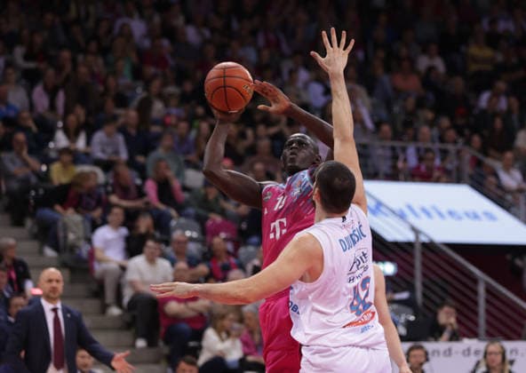 Kur Jongkuch Bonn throws in front of Nemanja Djurisic MBC , Telekom Baskets Bonn vs Syntainics MBC, easyCredit BBL, Matchday 23, Telekom Dome Bonn, 08 03 2026