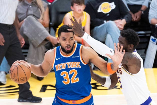 March 8, 2026, Los Angeles, California, USA: New York KnicksÃ¢â‚¬â ¢ Karl-Anthony Towns (32) is defended by Los Angeles LakersÃ¢â‚¬â ¢ Deandre Ayton (5) during an NBA, Basketball Herren, USA basketball game at Crypto.com Arena on Sunday, March 8, 2026 in Los Angeles. NBA 2026: Knicks Vs Lakers  - ZUMAc68_ 20260308_zaf_c68_016 Copyright: xRingoxChiux