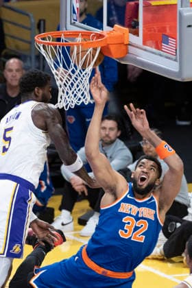 March 8, 2026, Los Angeles, California, USA: New York KnicksÃ¢â‚¬â ¢ Karl-Anthony Towns (32) goes to the basket under pressure from Los Angeles LakersÃ¢â‚¬â ¢ Deandre Ayton (5) during an NBA, Basketball Herren, USA basketball game at Crypto.com Arena on Sunday, March 8, 2026 in Los Angeles. NBA 2026: Knicks Vs Lakers  - ZUMAc68_ 20260308_zaf_c68_017 Copyright: xRingoxChiux