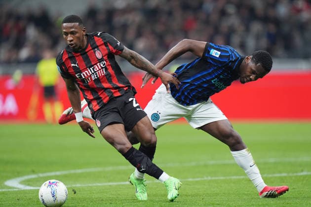 AC Milan s Pervis Estupinan fights for the ball with Inter Milan s Ange-Yoan Bonny during the Serie A soccer match between Milan and Inter at the San Siro Stadium in Milan , north Italy - Sunday , March 08 , 2026. - Soccer .  Copyright: xSpada LaPressex