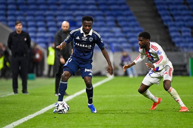Olympique Lyonnais v Paris FC - Ligue 1 McDonald s 2025 2026 27 Moses SIMON (pfc) - 22 Clinton MATA PEDRO LOURENCO (ol) during the Ligue 1 McDonald s match between Lyon and Paris FC at Groupama Stadium on March 8, 2026 in Lyon, France. Lyon France  Copyright: xFEPx 776348314