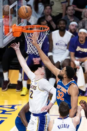 March 8, 2026, Los Angeles, California, USA: Los Angeles LakersÃ¢â‚¬â ¢ Jake LaRavia (12) goes past New York KnicksÃ¢â‚¬â ¢ Karl-Anthony Towns (32) to the basket during an NBA, Basketball Herren, USA basketball game at Crypto.com Arena on Sunday, March 8, 2026 in Los Angeles. NBA 2026: Knicks Vs Lakers  - ZUMAc68_ 20260308_zaf_c68_037 Copyright: xRingoxChiux