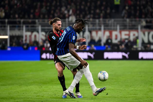 AC Milan v FC Internazionale - Serie A Yann Bisseck of FC Internazionale competes for the ball with Adrien Rabiot of AC Milan during the Serie A football match between AC Milan and FC Internazionale. Milan Italy Copyright: xNicolòxCampox