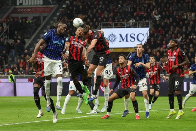 March 8, 2026, Milan: FC Inter s defender Yann Bisseck in action against AC Milan s mildfielder Adrien Rabiot (right) and AC Milan s defender Pervis Estupinan during the Italian Serie A soccer match between AC Milan and FC Inter at Giaseppe Meazza Stadium in Milan, Italy, 8 March 2026. ANSA ROBERTO BREGANI. Serie A: Milan-Inter  - ZUMAa110 20260308_zaf_a110_077 Copyright: xRobertoxBreganix