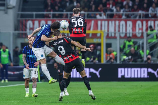 CALCIO - Serie A - AC Milan vs Inter - FC Internazionale Niclas Fullkrug of AC Milan competes for the ball with Carlos Augusto of FC Internazionale during Serie A 2025 26 football match between AC Milan and FC Internazionale at San Siro Stadium in Milan Milan Italy  Copyright: xIPAxSport ABACAx