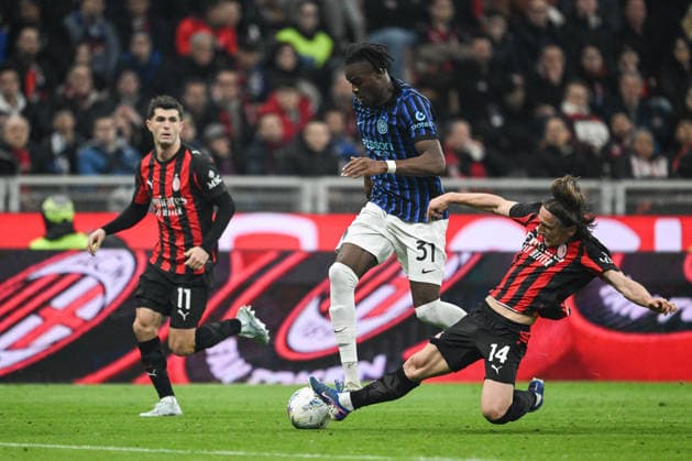 CALCIO - Serie A - AC Milan vs Inter - FC Internazionale Yann Bisseck of FC Inter and Luka Modric of AC Milan in action during the Italian Serie A football match between AC Milan and Inter FC Internazionale on 8 March 2026 at Giuseppe Meazza San Siro Siro stadium in Milan, Italy Milan Italy  Copyright: xIPAxSport ABACAx