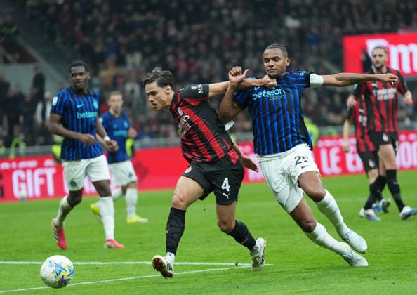 (260309) -- MILAN, March 9, 2026 -- AC Milan s Samuele Ricci (L) vies with Inter Milan s Manuel Akanji during an Italian Serie A football match between AC Milan and Inter Milan in Milan, Italy, March 8, 2026. ) (SP)ITALY-MILAN-FOOTBALL-SERIE A-AC MILAN VS INTER MILAN LixJing 