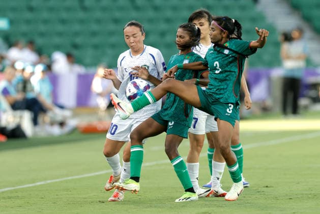 SOCCER ASIAN CUP BANGLADESH UZBEKISTAN, Diyorakhon Khabibullaeva of Uzbekistan and Shamsunnahar Sr. of Bangladesh compete for the ball during the AFC Women™s Asian Cup Group B match between Bangladesh and Uzbekistan at HBF Park in Perth, Monday, March 9, 2026.( NO ARCHIVING, EDITORIAL USE ONLY PERTH WESTERN AUSTRALIA AUSTRALIA  Copyright: xRICHARDxWAINWRIGHTx 20260309164475387435