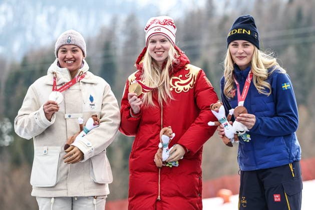 ITALY, VENETO - MARCH 9, 2026: Silver medallist Aurelia Richard of France, gold medal winner Varvara Voronchikhina of Russia and bronze medallist Ebba Aarsjoe of Sweden during the victory ceremony for the women s para alpine skiing super G standing event at Tofane Alpine Skiing Centre during the 2026 Winter Paralympic Games, in Cortina d Ampezzo, Province of Belluno 2026 Winter Paralympics: Para Alpine Skiing  - ZUMAt113 20260309_zaa_t113_153 Copyright: xMikhailxTereshchenkox