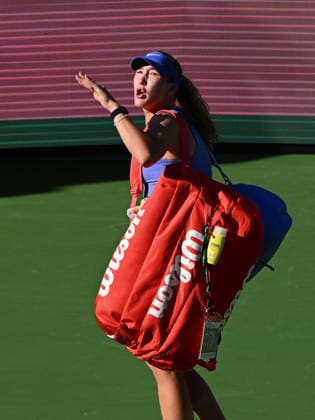 INDIAN WELLS, CA - MARCH 09: Mirra Andreeva (RUS) has some words for the fans as she leaves stadium one after losing a WTA, Tennis Damen tennis match during the BNP Paribas Open played on March 9, 2026 at the Indian Wells Tennis Garden in Indian Wells, CA. (Photo by John Cordes Icon Sportswire) TENNIS: MAR 09 BNP Paribas Open EDITORIAL USE ONLY Icon506260309049