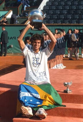 Gustavo Kuerten is a Brazilian professional tennis player and former world No. 1. He has been a professional since 1995. Nicknamed Guga, he is a three-time French Open singles champion (1997, 2000, 2001). 
