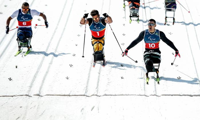 ITALY, TESERO - MARCH 10, 2026: Zixu Liu of China, Cristian Westemaier Ribera of Brazil, and Yerbol Khamitov (L-R) of Kazakhstan finish a men s para cross-country skiing sitting sprint final at Tesero Cross-Country Stadium during the 2026 Winter Paralympic Games 2026 Winter Paralympics: Para Cross-Country Skiing  - ZUMAt113 20260310_zaa_t113_146 Copyright: xMikhailxTereshchenkox