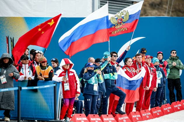ITALY, TESERO - MARCH 10, 2026: Supporters from China and Russia attend the victory ceremony for the women s para cross-country skiing classic vision impaired sprint event at Tesero Cross-Country Stadium during the 2026 Winter Paralympic Games 2026 Winter Paralympics: Para Cross-Country Skiing  - ZUMAt113 20260310_zaa_t113_253 Copyright: xMikhailxTereshchenkox