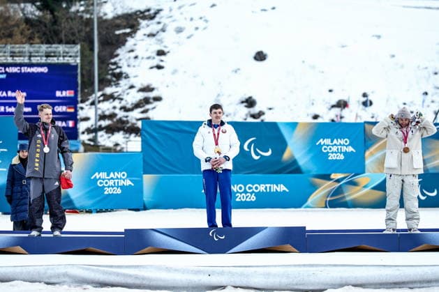 ITALY, TESERO - MARCH 10, 2026: Silver medalist Sebastian Marburger of Germany, gold medalist Raman Svirydzenka of Belarus, and Benjamin Daviet (L-R) of France poses during the victory ceremony for the men s para cross-country skiing classic standing sprint event at Tesero Cross-Country Stadium during the 2026 Winter Paralympic Games 2026 Winter Paralympics: Para Cross-Country Skiing  - ZUMAt113 20260310_zaa_t113_274 Copyright: xMikhailxTereshchenkox