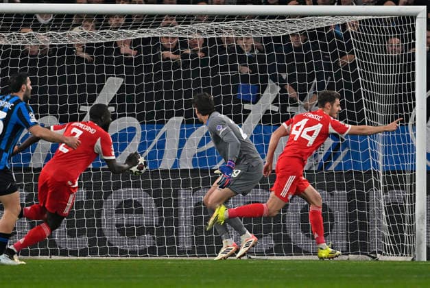 10 03 2026, Football UEFA Championsleague 2025 2026 Round of 16, Atalanta Bergamo FC Bayern München, in the New Balance Arena Bergamo, Italy , Josip Stanisic Bayern München scores to 0 1 against goalkeeper Marco Carnesecchi Atalanta Bergamo DFL and DFB regulations prohibit any use of photographs as image sequences and or quasi video