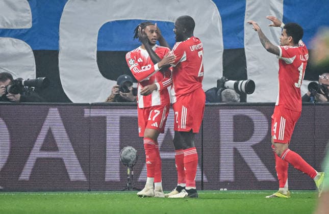FOOTBALL CHAMPIONS LEAGUE SEASON 2025 2026 Round of 16 first leg 10 03 2026 Atalanta Bergamo FC Bayern Muenchen CHEERS FC Bayern Muenchen 0 2 goal scorer Michael Olise embraced by Dayot Upamecano and Luis Diaz from left to right