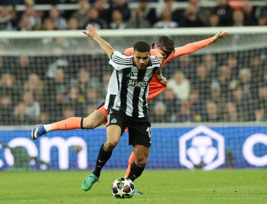 Newcastle Upon Tyne, England, 10th March 2026. b12 tussles with Robert Lewandowski of FC Barcelona, Barca during the Newcastle United vs FC Barcelona UEFA Champions League match at St. James Park, Newcastle Upon Tyne. Picture credit should read: Nigel Roddis Sportimage EDITORIAL USE ONLY. No use with unauthorised audio, video, data, fixture lists, club league logos or live services. Online in-match use limited to 120 images, no video emulation. No use in betting, games or single club league player publications. SPI_046_NR_NEWC_BARCx SPI-4596-0046