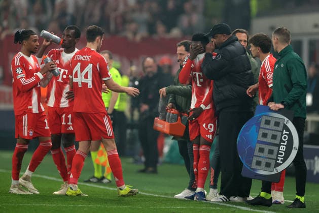 Bergamo, Italy, 10th March 2026. A distressed Alphonso Davies of Bayern Munchen is comforted by Vincent Company Head Coach of Bayern Munchen as he heads for the dressing room after picking up an injury during the Atalanta vs Bayern Munich UEFA Champions League match at Gewiss Stadium, Bergamo. Picture credit should read: Jonathan Moscrop Sportimage EDITORIAL USE ONLY. No use with unauthorised audio, video, data, fixture lists, club league logos or live services. Online in-match use limited to 120 images, no video emulation. No use in betting, games or single club league player publications. SPI_045_ATALANTA_BAYERN_UCL SPI-4583-0048