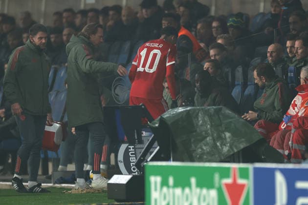 Bergamo, Italy, 10th March 2026. Jamal Musiala of Bayern Munchen is accompanied to the bench after pulling up late on in the Atalanta vs Bayern Munich UEFA Champions League match at Gewiss Stadium, Bergamo. Picture credit should read: Jonathan Moscrop Sportimage EDITORIAL USE ONLY. No use with unauthorised audio, video, data, fixture lists, club league logos or live services. Online in-match use limited to 120 images, no video emulation. No use in betting, games or single club league player publications. SPI_052_ATALANTA_BAYERN_UCL SPI-4583-0054