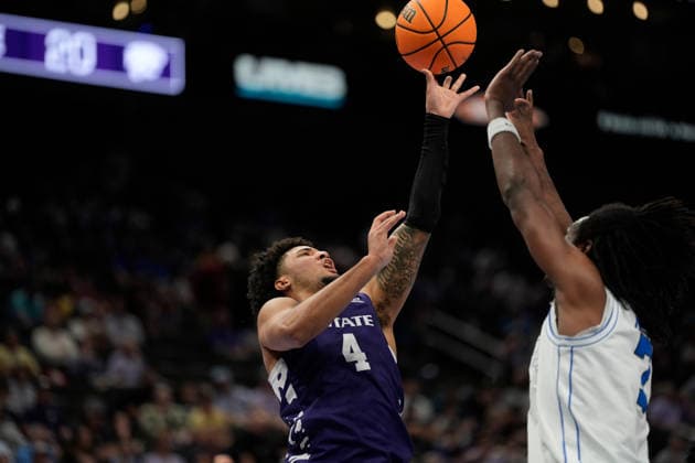 MAR 10 2026: Kansas State Wildcats guard PJ Haggerty (4) scores against BYU Cougars forward Khadim Mboup (7) and 1 in the Big 12 Championship Tournament at T-Mobile center, Kansas City, Missouri. CSM. NCAA, College League, USA Basketball 2026: Kansas State Vs BYU Big 12 Tournament  - ZUMAc04_ 20260310_zma_c04_082 Copyright: xJonxRobichaudx