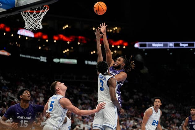 MAR 10 2026: Kansas State Wildcats forward Khamari McGriff (21) scores against BYU Cougars forward AJ Dybantsa (3) in the Big 12 Championship Tournament at T-Mobile center, Kansas City, Missouri. CSM. Kansas City United States - ZUMAc04_ 20260310_zma_c04_084 Copyright: xJonxRobichaudx
