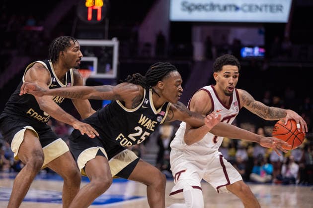 March 10, 2026: Wake Forest Demon Deacons forward Tre von Spillers (25) reaches for the ball against Virginia Tech Hokies guard Jailen Bedford (0) during the second half of the 2025 ACC Men s Baskeetball Championship at Spectrum Center in Charlotte, NC. ( ) Charlotte United States - ZUMAc04_ 20260310_zma_c04_137 Copyright: xScottxKinserx