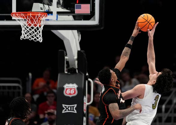 MAR 10 2026: Oklahoma State Cowboys forward Christian Coleman (4) blocks Colorado Buffaloes forward Alon Michaeli (3) in the Big 12 Championship Tournament at T-Mobile center, Kansas City, Missouri. CSM. Kansas City United States - ZUMAc04_ 20260310_zma_c04_201 Copyright: xJonxRobichaudx