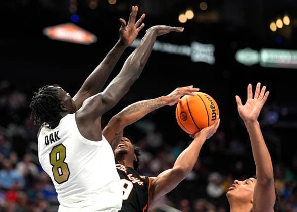 MAR 10 2026: Oklahoma State Cowboys guard Anthony Roy (9) forces up a shot against Colorado Buffaloes forward Bangot Dak (8) in the Big 12 Championship Tournament at T-Mobile center, Kansas City, Missouri. CSM. Kansas City United States - ZUMAc04_ 20260310_zma_c04_204 Copyright: xJonxRobichaudx