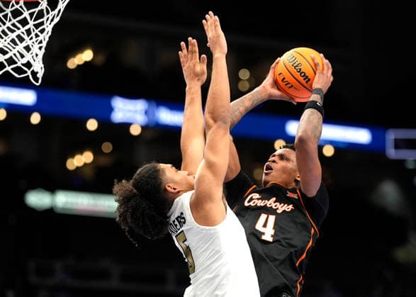 MAR 10 2026: Oklahoma State Cowboys forward Christian Coleman (4)scores against Colorado Buffaloes forward Alon Michaeli (3) in the Big 12 Championship Tournament at T-Mobile center, Kansas City, Missouri. CSM. Kansas City United States - ZUMAc04_ 20260310_zma_c04_213 Copyright: xJonxRobichaudx