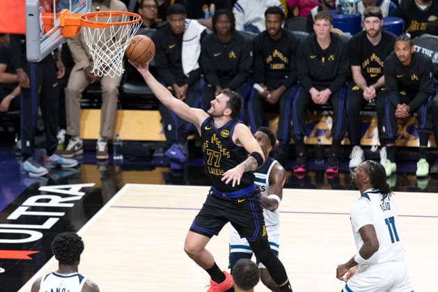 March 10, 2026, Los Angeles, California, USA: Los Angeles LakersÃ¢â‚¬â ¢ Luka DonÄÂiÄ¡ (77) goes past Minnesota TimberwolvesÃ¢â‚¬â ¢ Naz Reid (11) to the basket during an NBA, Basketball Herren, USA basketball game at Crypto.com Arena on Tuesday, March 10, 2026 in Los Angeles. NBA 2026: Timberwolves Vs Lakers  - ZUMAc68_ 20260310_zaf_c68_042 Copyright: xRingoxChiux