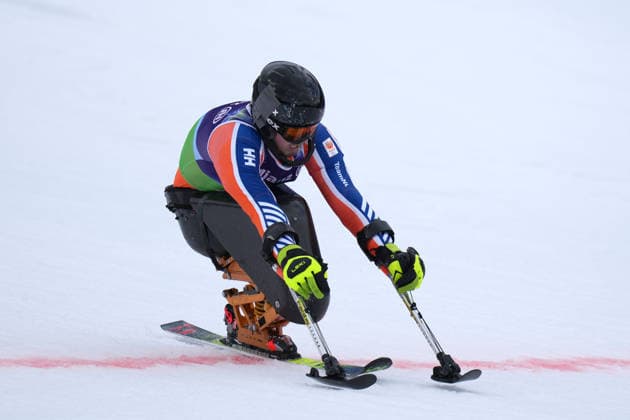 (260311) -- CORTINA D AMPEZZO, March 11, 2026 -- Jeroen Kampschreur of the Netherlands crosses the finish line during the Para Alpine Skiing Men s Alpine Combined Sitting event at the Milan-Cortina 2026 Paralympic Winter games, Winterspiele,Spiele, Summer games in Cortina D ampezzo, Italy, March 10, 2026. ) (SP)ITALY-CORTINA D AMPEZZO-PARALYMPIC WINTER GAMES-PARA ALPINE SKIING-MEN S ALPINE COMBINED-SITTING LianxYi 