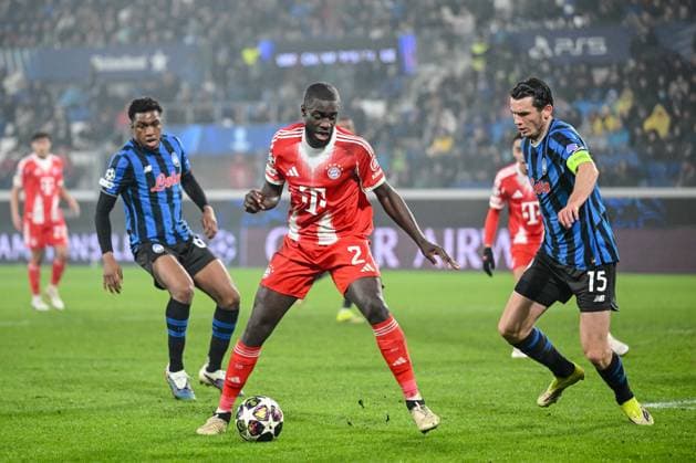Dayot Upamecano FC Bayern München and Marten de Roon Atalanta BC battle for the ball during the UEFA Champions League 2025 26 Round of 16 First Leg match between Atalanta BC and FC Bayern München at Stadio di Bergamo on March 10, 2026 in Bergamo, Italy Photo by Harry Langer DeFodi Images
