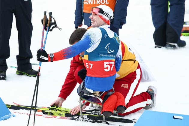 ITALY, TESERO - MARCH 11, 2026: Ivan Golubkov of Russia and President of the Russian Paralympic Committee Pavel Rozhkov are seen after the men s para cross-country skiing 10km interval start sitting final at Tesero Cross-Country Stadium during the 2026 Winter Paralympic Games. Mikhail Tereshchenko TASS  89878978