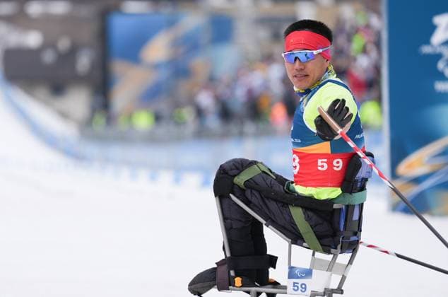 (260311) -- TESERO, March 11, 2026 -- Mao Zhongwu of China celebrates after the final match of the men s 10km interval start sitting of Para Cross-Country Skiing at the Milan-Cortina 2026 Paralympic Winter games, Winterspiele,Spiele, Summer games in Tesero, Italy, March 11, 2026. ) (SP)ITALY-TESERO-PARALYMPIC WINTER GAMES-PARA CROSS-COUNTRY-MEN S 10KM INTERVAL START SITTING LianxZhen 